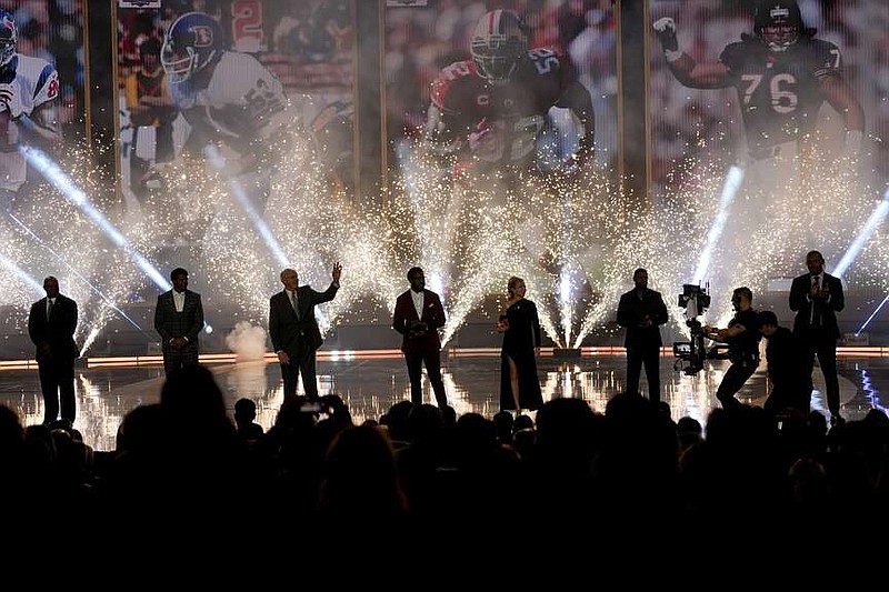 NFL Hall of Fame Class of 2024 arrives on stage during the NFL Honors award show ahead of the Super Bowl 58 football game Thursday, Feb. 8, 2024, in Las Vegas. The San Francisco 49ers face the Kansas City Chiefs in Super Bowl 58 on Sunday. (AP Photo/David J. Phillip)