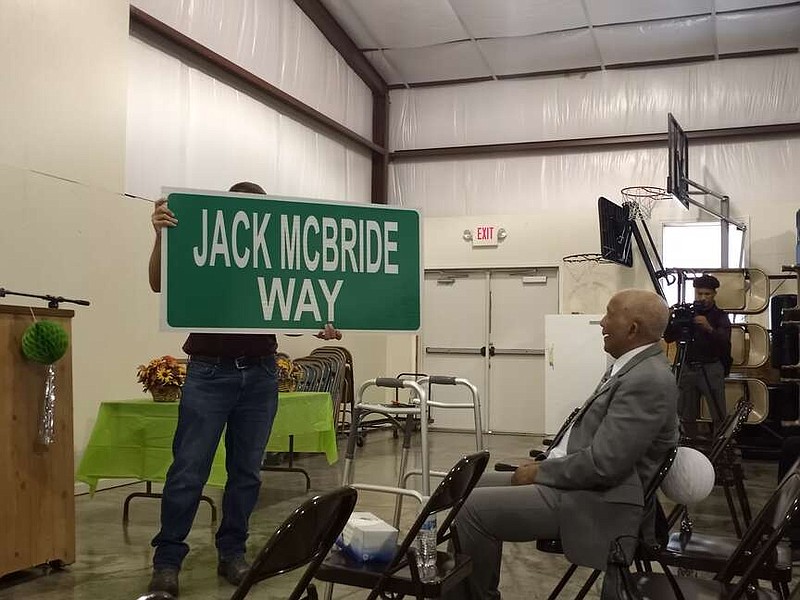 File photo
In this Fulton Sun file photo, city engineer Kyle Bruemmer shows Jack McBride a road sign named after him. A portion of West 9th Street was designated as Jack McBride Way in 2022.
