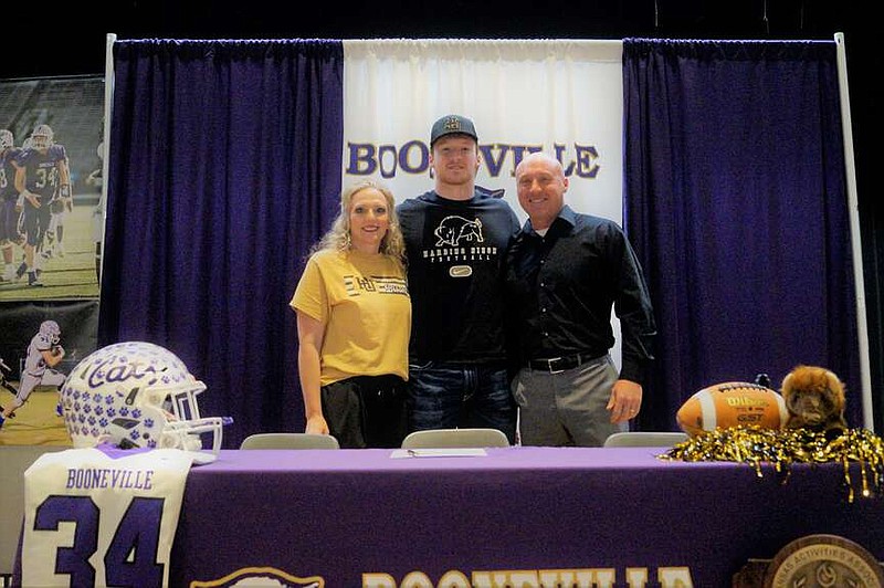 Booneville's Dax Goff is joined by his parents, Candy and Trent Goff, at national signing day Wednesday at the Booneville High School auditorium. Goff signed with Harding University.
(Special to River Valley Democrat-Gazette/Leland Barclay)