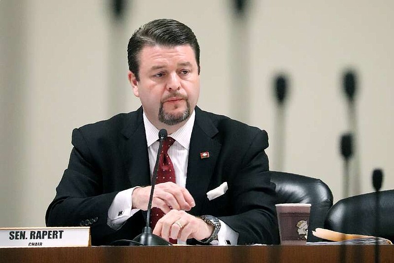 FILE - State Sen. Jason Rapert, R-Conway, presides over a Senate committee at the state Capitol on March 14, 2018, in Little Rock, Ark. Rapert, a former Arkansas lawmaker who has proposed suspending funding to libraries suing the state over restrictions on materials was confirmed by the Senate Monday, Dec. 11, 2023 to a spot on the state library board. (AP Photo/Kelly P. Kissel, File)