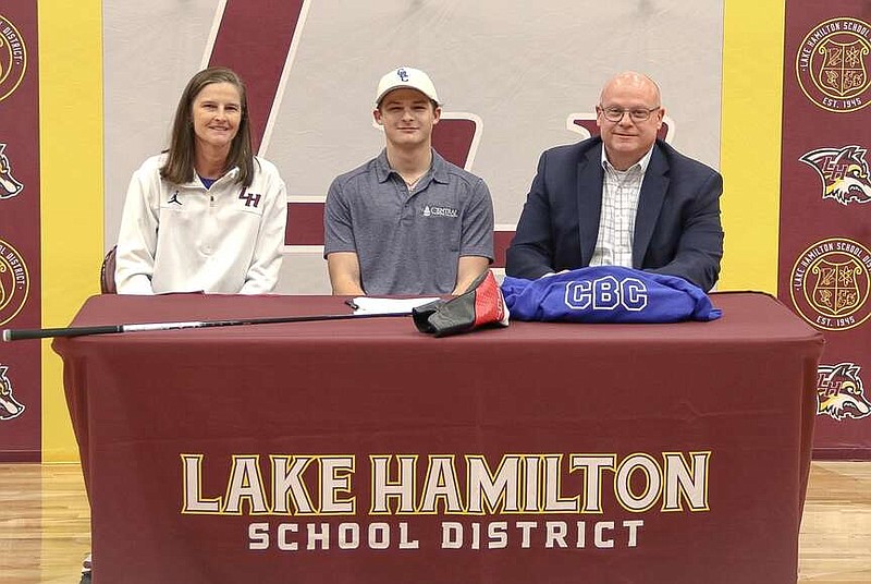 Lake Hamilton senior golfer Jack Higginbotham, center, is pictured with his family Wednesday at Wolf Arena after signing his letter of intent to play golf at Central Baptist University. (Submitted photo)