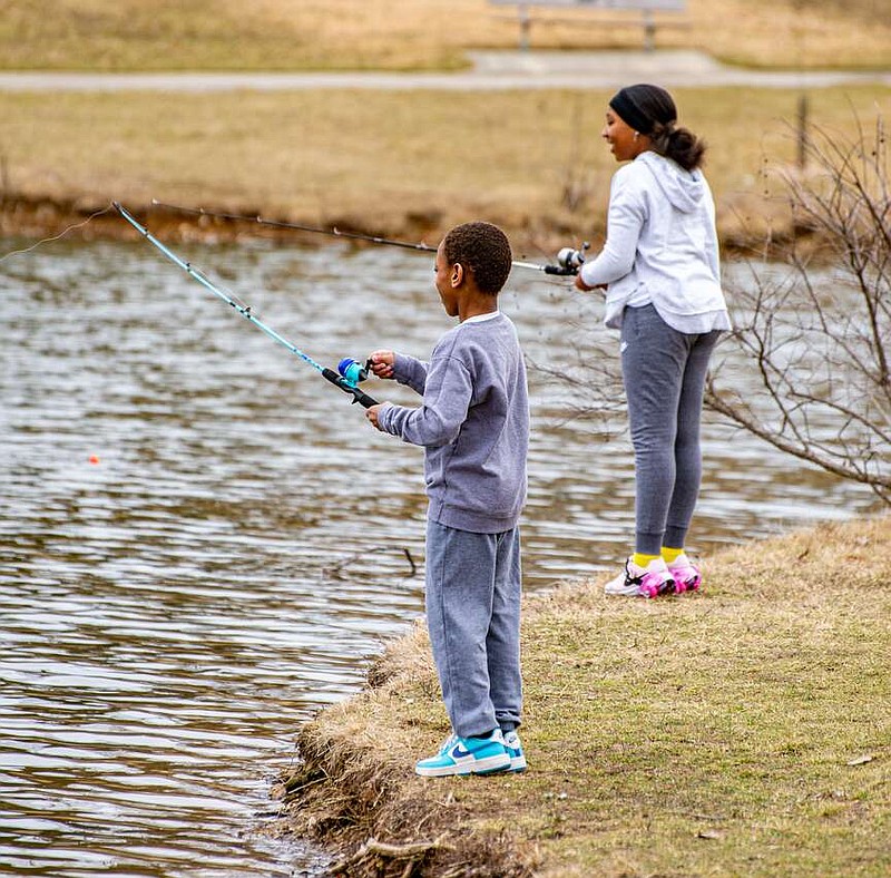 Ken Barnes/News Tribune photo: 
Brother and sister Daniel and Elizabeth Mensah fish Saturday, Feb. 10, 2024, at McKay Park Lake during the Missouri Department of Conservation's family fishing day.