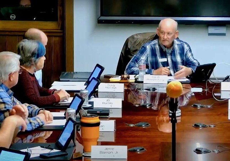 David Brandenburg (right), chairman of the Bella Vista Property Owners Association Board of Directors, discusses a motion to prohibit the use of electric hydrofoils on association lakes Jan. 25 prior to a vote.

(Submitted Photo/Bella Vista Property Owners Association)