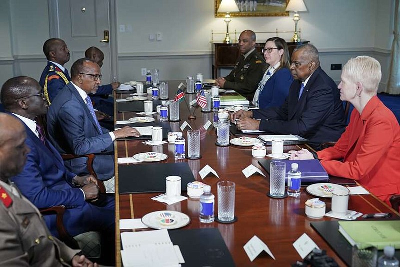 Kenya's Defense Minister Aden Duale, center left, speaks during a meeting with Defense Secretary Lloyd Austin, center right, at the Pentagon in Washington, Wednesday, Feb. 7, 2024. (AP Photo/Susan Walsh)