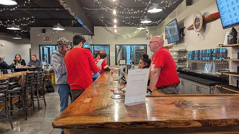 Ryan Pivoney/News Tribune photo: 
Shawn Thompson, bartender at Last Flight Brewing Company in Jefferson City, takes a customer's order Sunday, Feb. 11, 2024, during the Super Bowl. The brewery extended its hours and invited regulars in to watch the game.