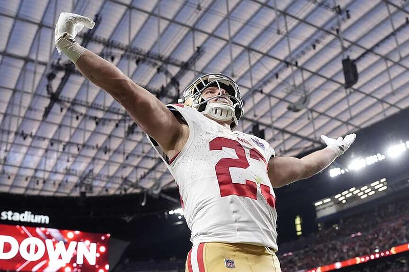 San Francisco 49ers running back Christian McCaffrey (23) celebrates a touchdown against the Kansas City Chiefs during the first half of the NFL Super Bowl 58 football game Sunday, Feb. 11, 2024, in Las Vegas. (AP Photo/George Walker IV)