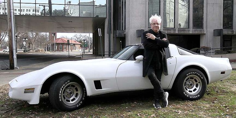 Magician Maxwell Blade stands beside his 1980 Chevrolet Corvette C3 near the Malco Theatre. (The Sentinel-Record/Donald Cross)
