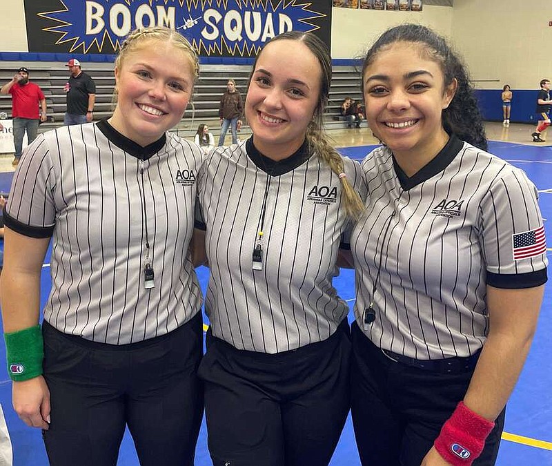 Submitted photo
The trio of Hadley Snyder, Vivi Edwards, Cailey Pittman (from left) are thought to be the lone female wrestling officials to work events in Arkansas this season. Edwards and Pittman both wrestled in high school in Arkansas, while Snyder grew up and wrestled in Texas before attending the University of Arkansas.