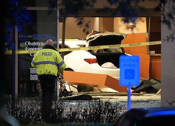 Fatal Texas crash ends in ER aquarium Barricaded shooter hits 3 D.C. officers 2 vandals arrested at National Archives First lady offers Valentine's lawn display | The Arkansas Democrat-Gazette - Vimarsana News