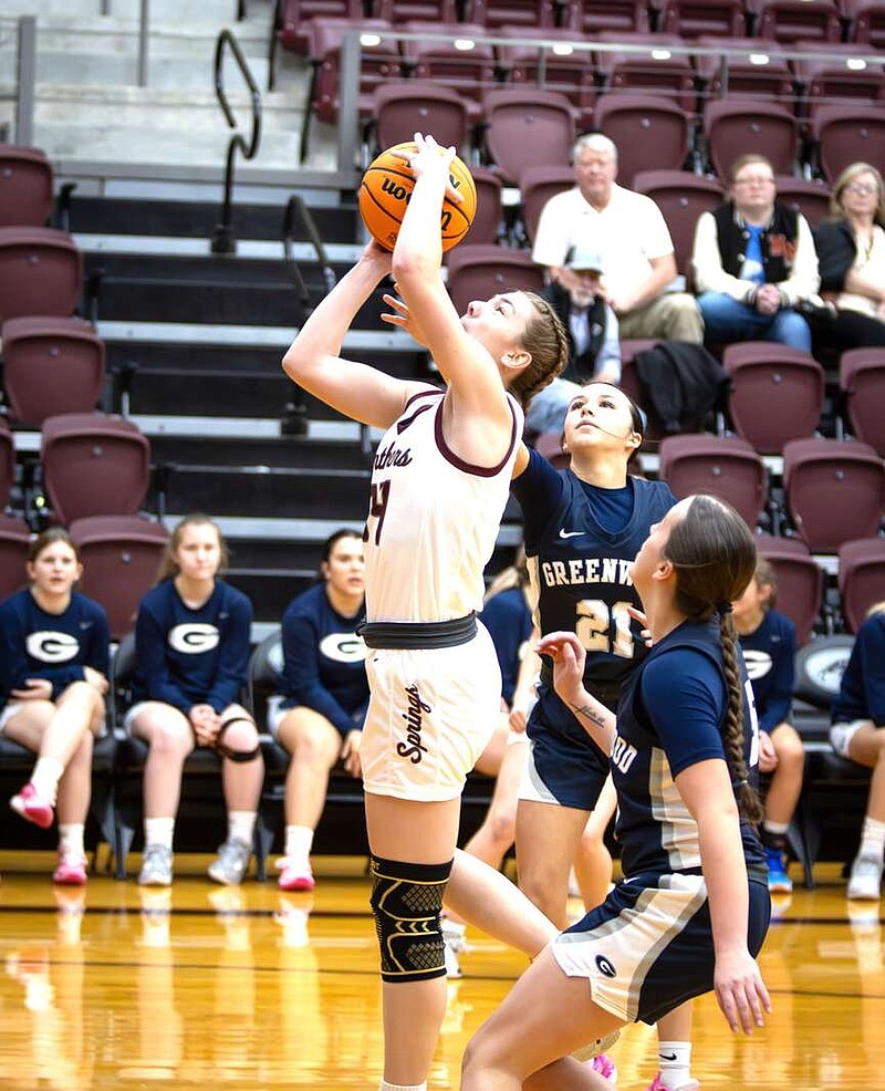 Photograph courtesy of Krystal Elmore Kaidence Prendergast of Siloam Springs goes up for an early basket against Greenwood at Panther Activity Center on Feb. 13