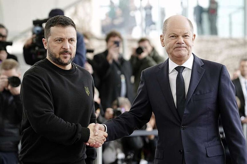 German Chancellor Olaf Scholz, right, welcomes Ukrainian President Volodymyr Zelenskyy in front of the chancellory in Berlin, Friday, Feb.16, 2024. (Kay Nietfeld/dpa via AP)