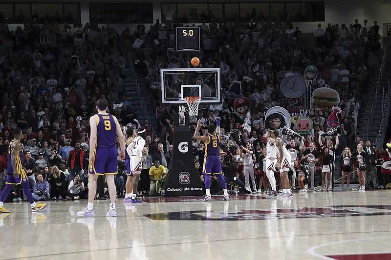 LSU guard Jordan Wright (6) makes two free throws for a one point lead during the second half of an NCAA college basketball game against South Carolina Saturday, Feb. 17, 2024, in Columbia, S.C. LSU won 64-63. (AP Photo/Artie Walker Jr.)