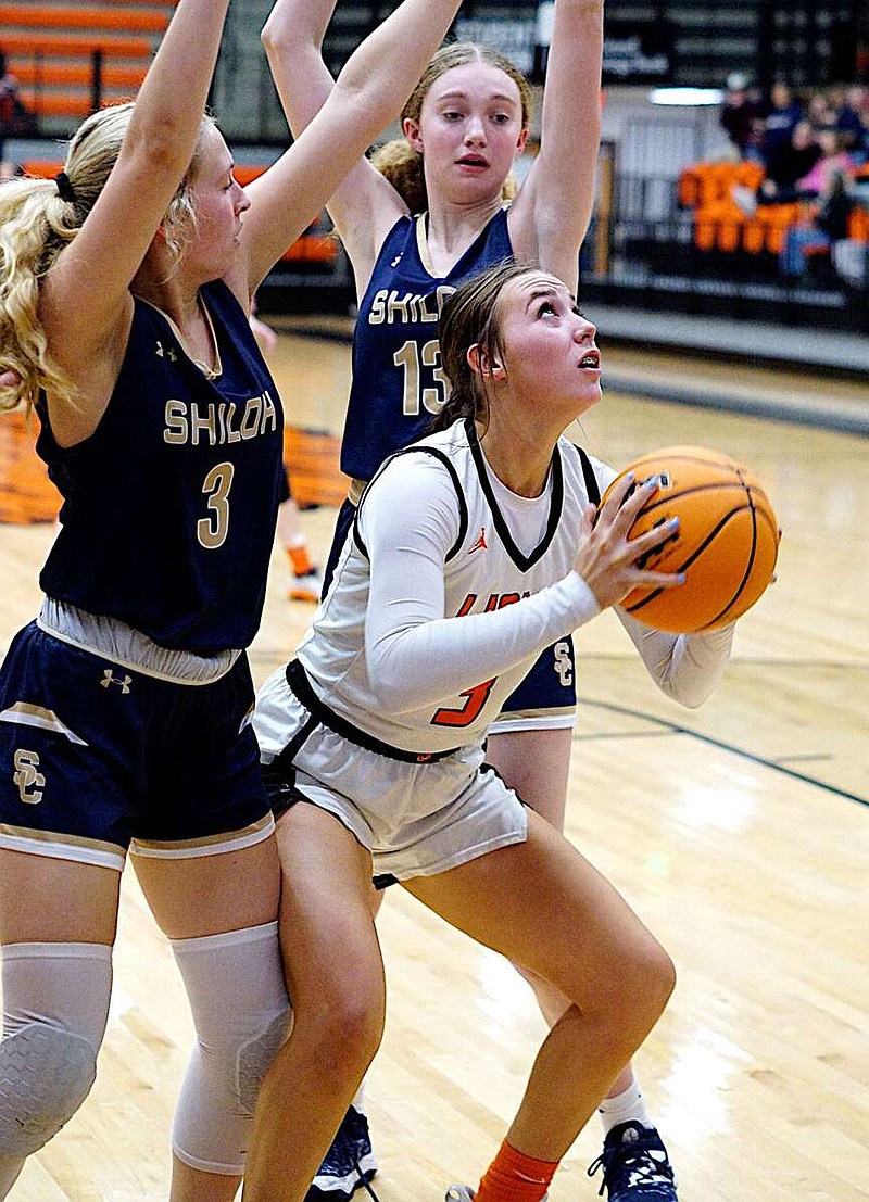Randy Moll/Westside Eagle Observer
Gravette senior Brooke Handle looks up to shoot from under the basket at Gravette's semi-final district tournament game against Shiloh Christian on Friday night in the Lions Den Arena.