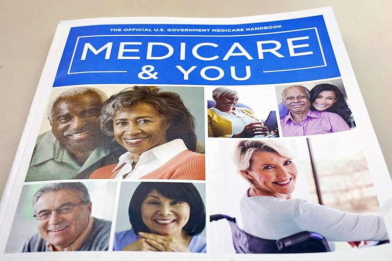 FILE - In this Nov. 8, 2018 file photo, the U.S. Medicare Handbook is photographed in Washington.  Many people choose Medicare Advantage plans without exploring their options or noticing what changes their plan may have made, according to research. But now that a new year has started, you may realize you picked the wrong plan during Medicare's fall open enrollment.   (AP Photo/Pablo Martinez Monsivais)