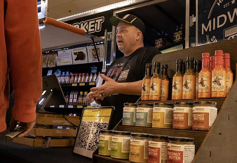 News Tribune file photo: 
Daniel Hipsher talks to people about his barbecue sauces and other products during the 2023 HBA Home Show.