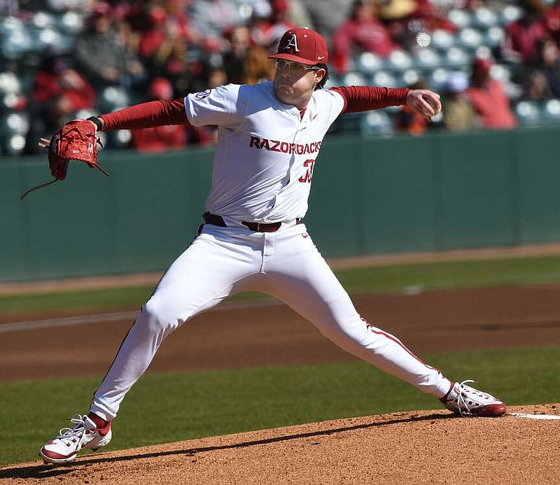Arkansas starter Colin Fisher delivers to the plate Monday, Feb. 19, 2024, during the first inning of the Razorbacks' 4-0 win over James Madison at Baum-Walker Stadium in Fayetteville.
(NWA Democrat-Gazette/Andy Shupe)�