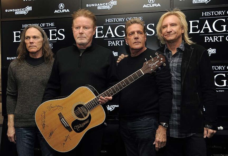 Members of The Eagles, from left, Timothy B. Schmit, Don Henley, Glenn Frey and Joe Walsh pose with an autographed guitar after a news conference at the Sundance Film Festival, Jan. 19, 2013, in Park City, Utah. On Wednesday, Feb. 21, 2024, an unusual criminal trial is set to open over the handwritten lyrics to the band's classic rock blockbuster “Hotel California.” Henley was born in Gilmer, Texas, and grew up in Linden, Texas, about a 40-mile drive from Texarkana. His most recent solo album, 2015's "Cass County," was named for the county of which Linden is the seat. (Photo by Chris Pizzello/Invision/AP, File)