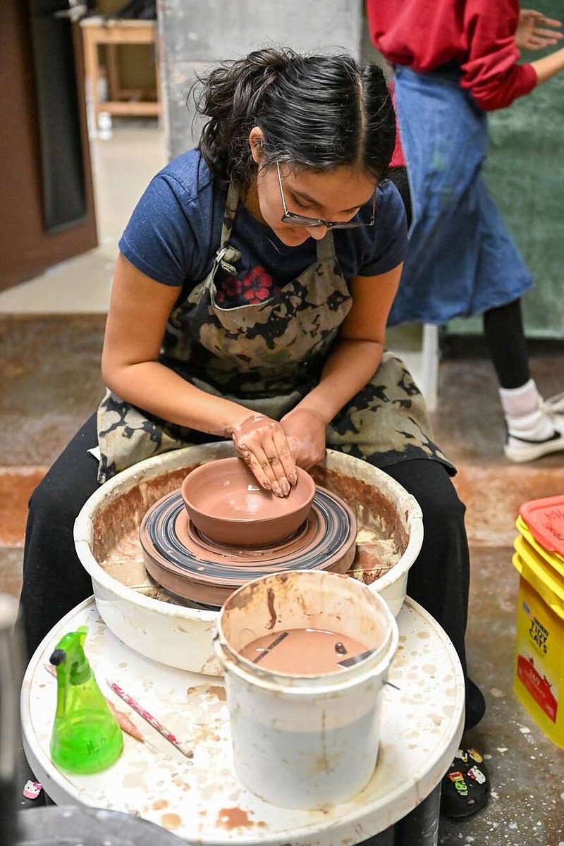 Monica Lopez sculpts a bowl on Wednesday, Feb. 21, 2024, at Van Buren Highschool. Students in Kara Hollandâ€™s classroom sculpted bowls for the Empty Bowls event next Thursday, Feb. 29, 2024, at Arts on Main in Van Buren. Attendees of the event can purchase a hand made bowl with proceeds going towards Community Services Clearing House "Meals for Kids" program. Visit rivervalleydemocratgazette.com/photo for today's photo gallery. (River Valley Democrat Gazette/Caleb Grieger)