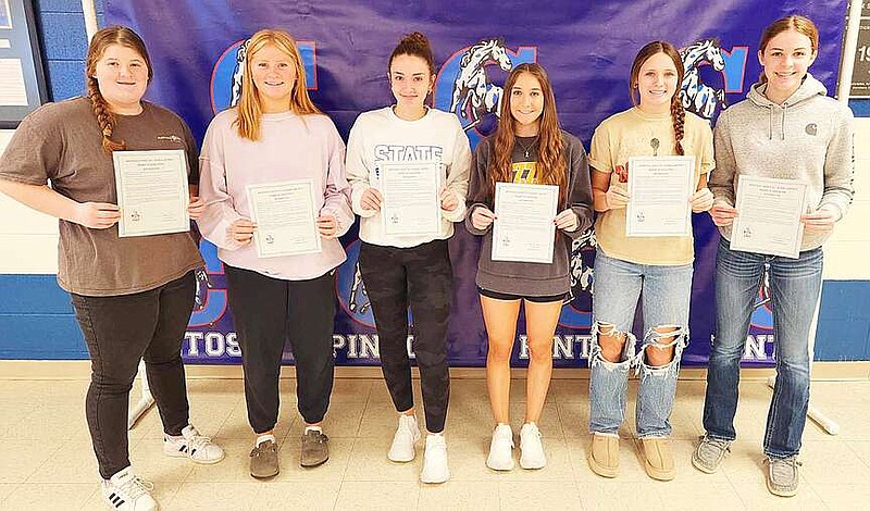 Courtesy/Ashley Anderson — California High School Lady Pintos softball Academic All State recipients pose with proclamations recognizing their achievements. Pictured, from left, are Madelyn Knipker, Ryleigh Roellig, Bayley Wood, Kinley Higgins, Peyton Dunham and Ella Burger. Sahara Labuary, Katherine Rohrbach, Brittney Johnson, Emily Burger and Kylee Wright are not pictured. The Lady Pintos softball team was ranked 10th in Class 3 academically with a 3.67 cumulative grade point average. The Missouri State High School Activities Association also awarded the team with its Outstanding Scholastic Achievement Award.