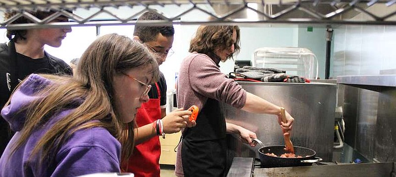 Annette Beard/Pea Ridge TIMES
Students in one of the culinary classes at Pea Ridge High School learn many skills under the guidance of Mrs. Jen Jacobs. This week, the students prepared the meals for the hospitality room at the 4A North Regional basketball tournament held in the PRHS Blackhawk Arena. For more photographs, go to the PRT gallery at https://tnebc.nwaonline.com/photos/.