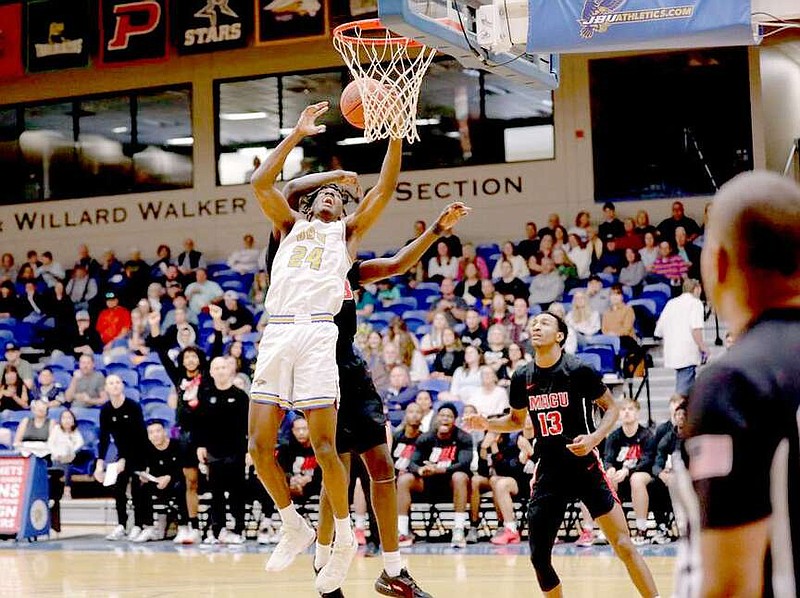 Photo courtesy of JBU Sports Information Network Tyren Collins of JBU goes up for a shot against Mid-America Christian on Feb. 24.