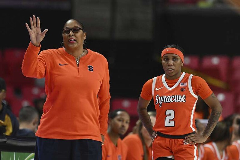 FILE - Syracuse coach Felisha Legette-Jack gestures as Dyaisha Fair looks on during an NCAA college basketball game Sunday, Nov. 19, 2023, in College Park, Md. Syracuse coach Felisha Legette-Jack encouraged star Dyaisha Fair to explore other options for her grad year this season. She didn't want one of the top scorers in NCAA history to go, but felt that Fair deserved a chance to play at the highest level possible for her fifth year. (AP Photo/Gail Burton, File)
