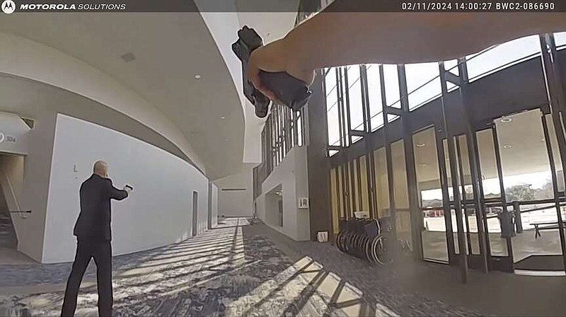 In this image taken from body camera video released by the Houston Police Department on Monday, Feb. 26, 2024, officers and security respond after exchanging gunfire with a woman who opened fire at celebrity pastor Joel Osteen's Houston megachurch Sunday, Feb. 11. Police say Genesse Moreno, 36, entered the church between Sunday services with her 7-year-old son and began firing an AR-style rifle. (Houston Police Department via AP)
