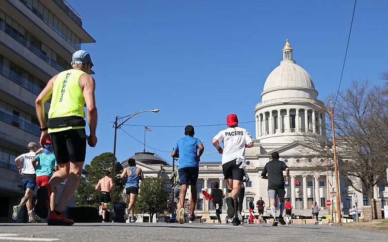 FILE - Runners approach the Arkansas State Capitol during the Little Rock Marathon on March 5, 2023. (Arkansas Democrat-Gazette/Colin Murphey)