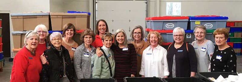 Members of Altrusa International of Bentonville/Bella Vista recently spent time stuffing snack packs for kids at the Samaritan Community Center. Each week the center provides 6,000 snack packs to children in 170 nearby schools. The snack packs help alleviate hunger on weekends for children who receive free breakfasts and lunches at school during the week. Because of their packing 850 children won't go hungry this weekend.

(Courtesy Photo)