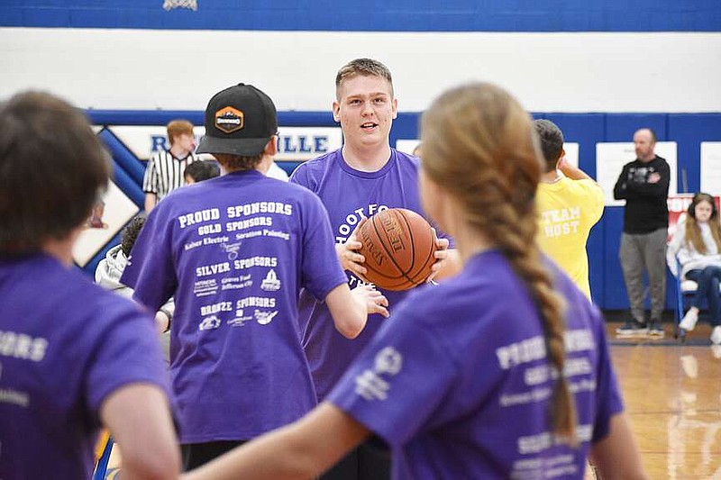 Democrat photo/Garrett Fuller
Camdenton High School senior Brandon Ziegler, center, decides whether or not to take a 3-pointer Feb. 28 during the Special Olympics basketball tournament at Russellville High School. Ziegler hit many 3s throughout the tournament, both in the team skills and 3-on-3 tournaments.