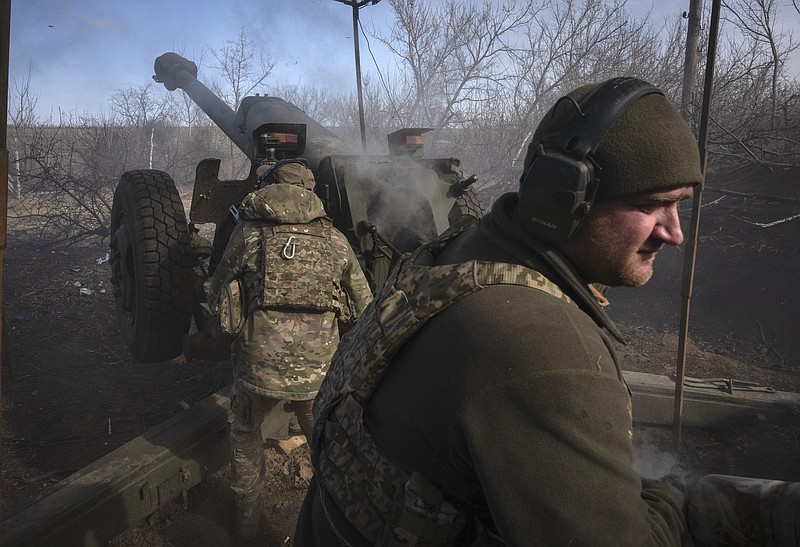 Ukrainian soldiers of 80th separate airborne assault brigade fires a D-30 cannon towards Russian positions at the front line, near Klishchiivka, Donetsk region, Ukraine, Saturday, March 2, 2024. (AP Photo/Efrem Lukatsky)