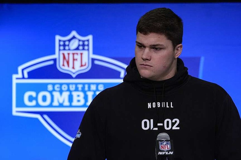 Notre Dame offensive lineman Joe Alt speaks during a press conference at the NFL football scouting combine in Indianapolis, Saturday, March 2, 2024. (AP Photo/Michael Conroy)