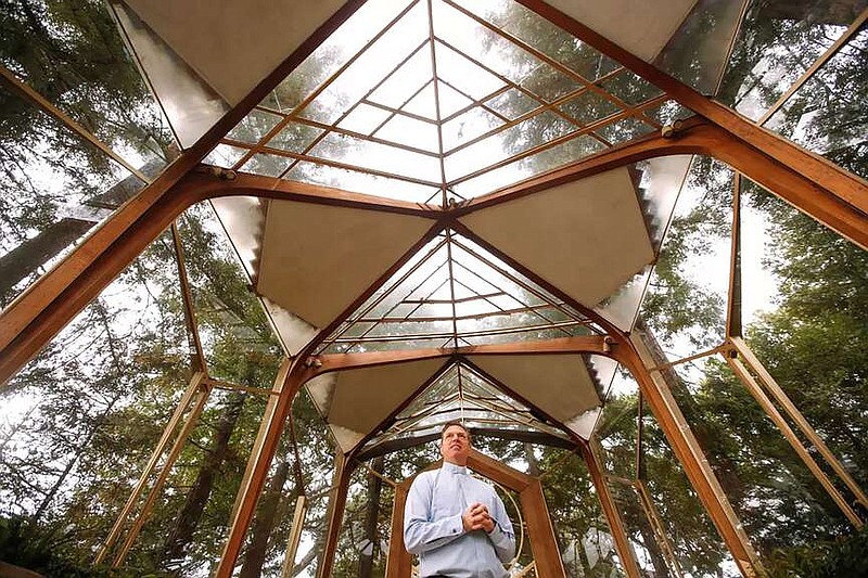 The Rev. David Brown stands inside the Wayfarers Chapel in Rancho Palos Verdes. He has launched an appeal on GoFundMe to try to raise money that can be used to stabilize the chapel, which sits on an accelerating landslide complex. (Genaro Molina/Los Angeles Times/TNS)