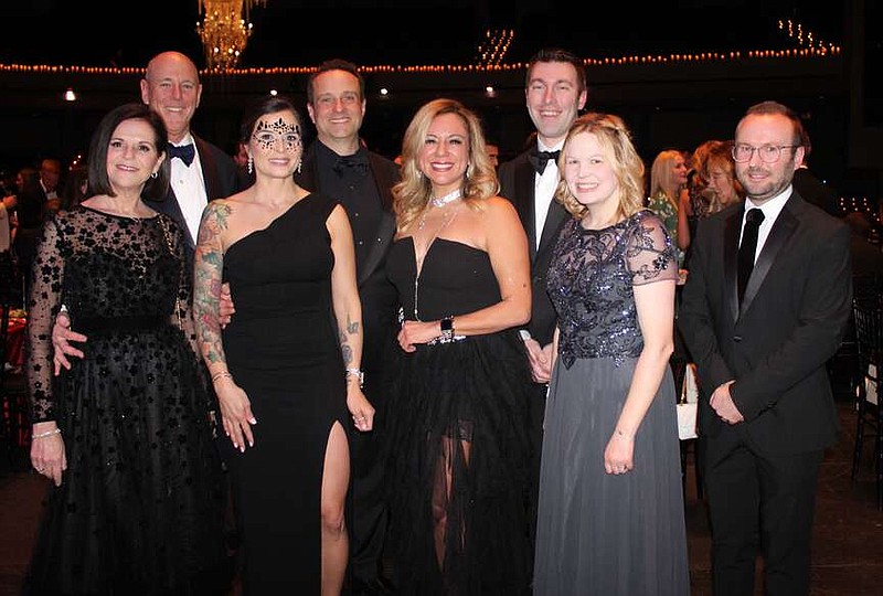 Barbara Putnam and Peter Lane, Walton Arts Center CEO (from left); Tara and Eric Howerton of presenting sponsor Flywheel; Jessica Duquesne, Brock and Natalie McKeel and Tom Ward, honorary chair, welcome supporters to the 13th annual Masquerade Ball at the center in Fayetteville. Duquesne and Brock served as the event co-chairs.
(NWA Democrat-Gazette/Carin Schoppmeyer)