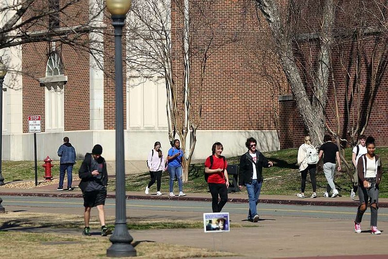 Students walk across the University of Central Arkansas campus in Conway on Friday, Feb. 23, 2024. (Arkansas Democrat-Gazette/Kyle McDaniel)