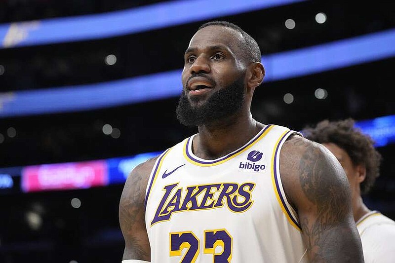 Los Angeles Lakers forward LeBron James looks toward fans after scoring during the second half of an NBA basketball game against the Denver Nuggets Saturday, March 2, 2024, in Los Angeles. (AP Photo/Mark J. Terrill)