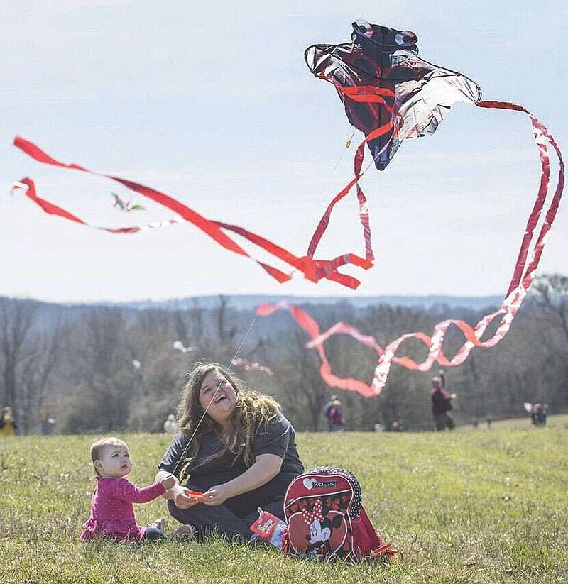 Tara Bell and daughter Matilda Bell, 1, of Fayetteville fly their kite Saturday, March 7, 2020, during the 19th annual Cane Hill Kite Festival at Springfield Ranch in Canehill. Last year the kite festival was cancelled due to weather, but this year hundreds gathered on a sunny day with strong wind. Check out nwaonline.com/200308Daily/ for today‚Äôs photo gallery.
(NWA Democrat-Gazette/Ben Goff)
