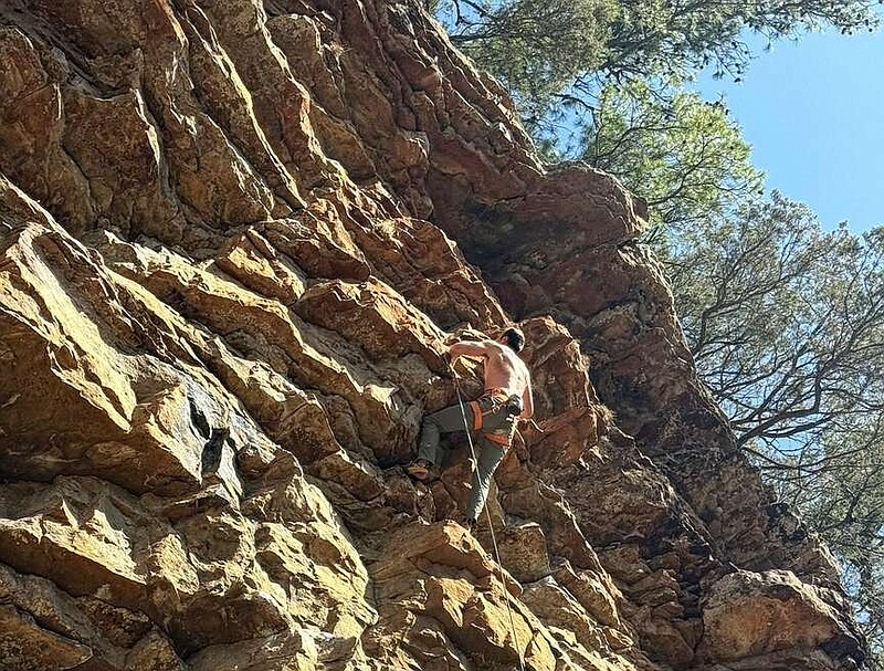 A rock climber conquers Chicken Leg Joe. (Special to the Democrat-Gazette/Bob Robinson)