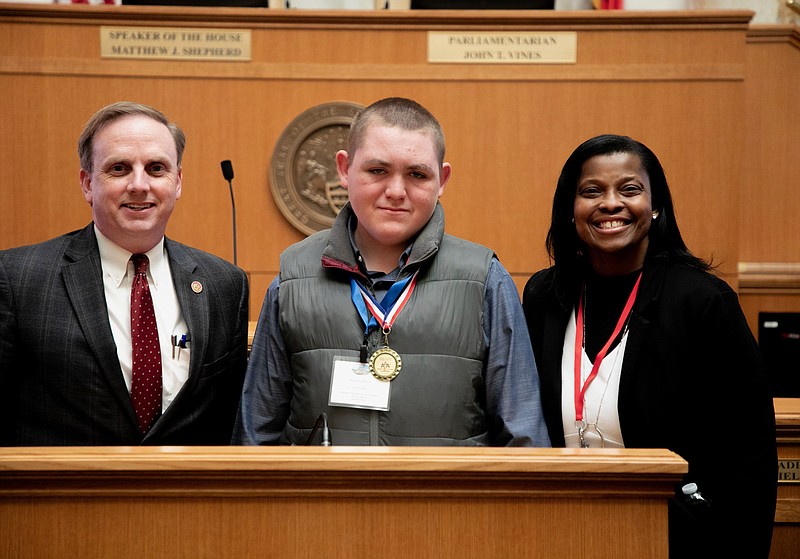 Speaker of The House Matthew Shepherd (El Dorado) stands with Keaton Nixon. Diamond Award recipient, and Kasey Porchia, AE Director at the Murmil Education Center. (Contributed)