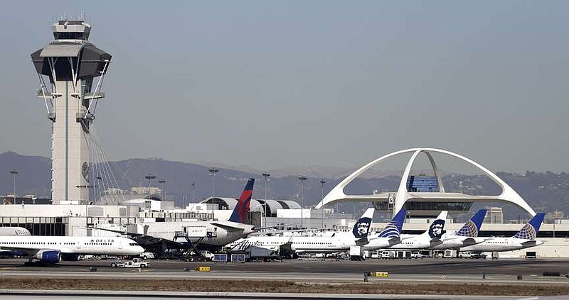 FILE - Airplanes sit on the tarmac at Los Angeles International Airport Friday, Nov. 1, 2013. A United Airlines jetliner headed to Mexico City from San Francisco made an emergency landing in Los Angeles on Friday, March 8, 2024 after the crew reported a hydraulics issue, in the fourth emergency involving a United Airlines flight this week. (AP Photo/Gregory Bull, File)