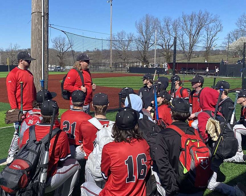 Daniel Bereznicki/McDonald County Press
After the game, Heath Alumbaugh, head coach for the Mustangs varsity baseball team, gives a pep talk with his athletes.
