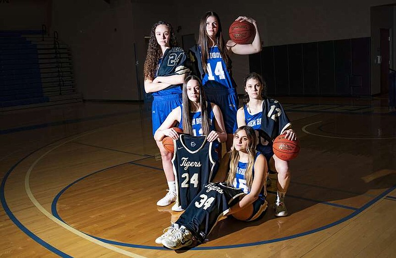 Former Bentonville Lady Tigers Emily Sanders (from top left), Bella Irlenborn, Abbey Sanders, Natalie Smith and Nadia Akbar pose for a portrait, Friday, March 8, 2024 at Bill George Arena at John Brown University in Siloam Springs. Visit nwaonline.com/photos for today's photo gallery.

(NWA Democrat-Gazette/Charlie Kaijo)