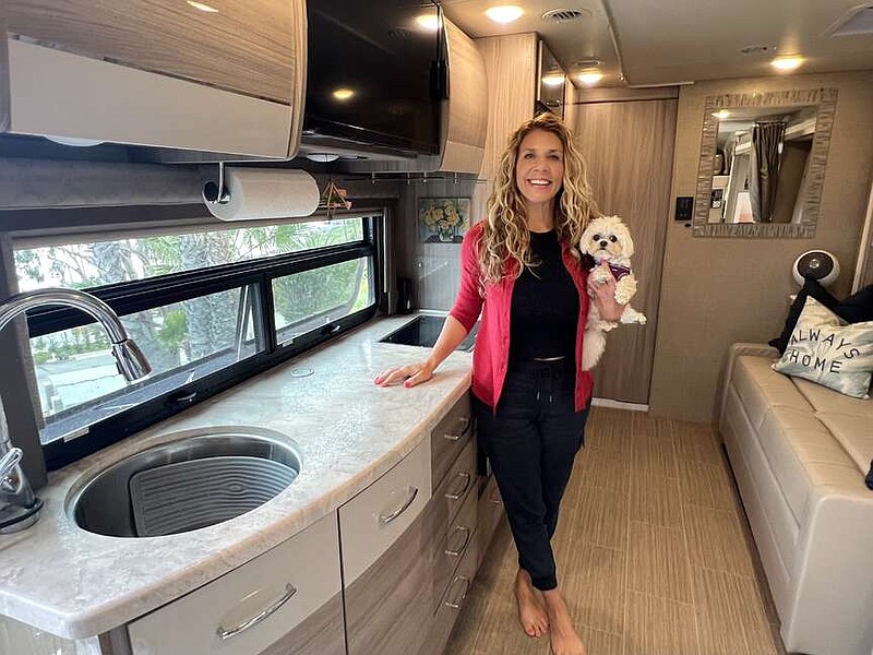 “After my kids left home and my divorce, the definition of home changed for me,” said Wendy Valentine, pictured in her RV with her Teacup Maltese, Daisy. (Courtesy of Wendy Valentine)