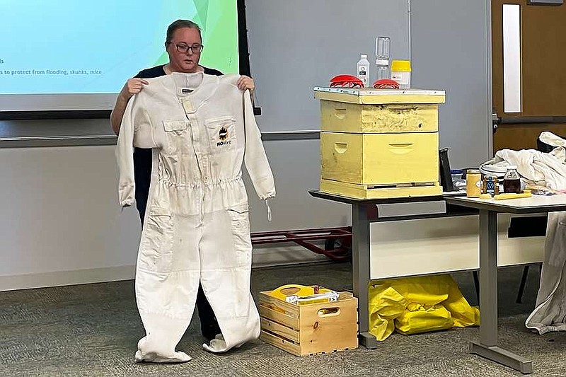 Heather McBride, an Advanced Beekeeper in the Texas Master Beekeeping Program, displays a protective suit during a presentation titled Getting Started With Honeybees on Monday, March 11, 2024, at Texas A and M University-Texarkana in Texarkana, Texas. Bowie County Master Gardeners and TAMUT's Extended Education and Community Development Department hosted the talk. (Staff photo by Karl Richter)
