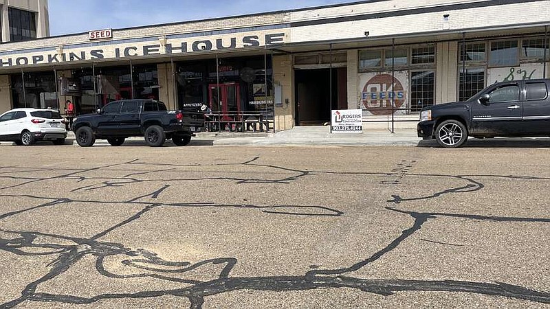 On Tuesday, March 12, 2024, in Texarkana, Arkansas, a faint stripe crossing East Third Street shows where the city installed speed bumps in May 2023 and removed them in February 2024. The city plans to reinstall speed bumps on East Third and East Broad streets in spring 2024. (Staff photo by Karl Richter)