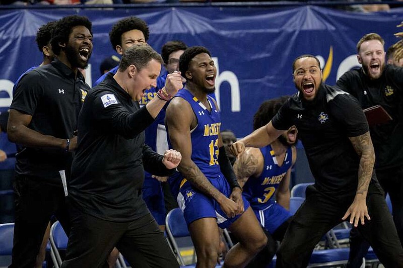 McNeese State coach Will Wade, second lfrom eft, reacts with his team during an NCAA college basketball game against New Orleans in New Orleans, Wednesday, March 6, 2024. Wade was suspended for the first 10 games of the 2023–24 season by the NCAA but the team went to a 28-3 record and finished first in the Southland Conference. (AP Photo/Matthew Hinton)