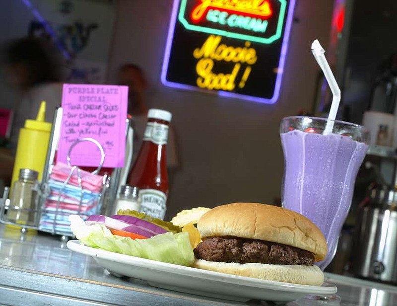 A hamburger, chips and purple vanilla shake at the original Purple Cow at 8206 Cantrell Road: The building, heavily damaged by the March 2023 tornado, is to be demolished and replaced.

(Democrat-Gazette file photo/Staton Breidenthal)