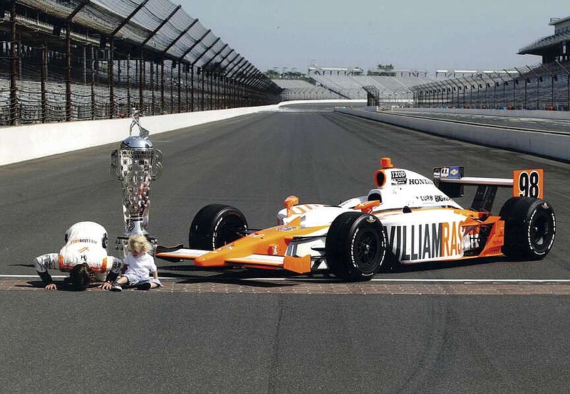 This image released by Max shows Dan Wheldon, left, with his son Sebastian in a scene from the HBO documentary "The Lionheart." (Max via AP)