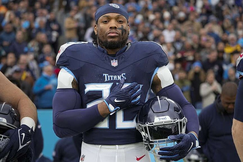 FILE -Tennessee Titans running back Derrick Henry stands for the national anthem before an NFL football game against the Jacksonville Jaguars, Sunday, Jan. 7, 2024, in Nashville, Tenn. Derrick Henry is back in the gym, eager to prove turning 30 is just a number that shouldn't affect the four-time Pro Bowl running back's value on the NFL's open market.(AP Photo/George Walker IV, File)