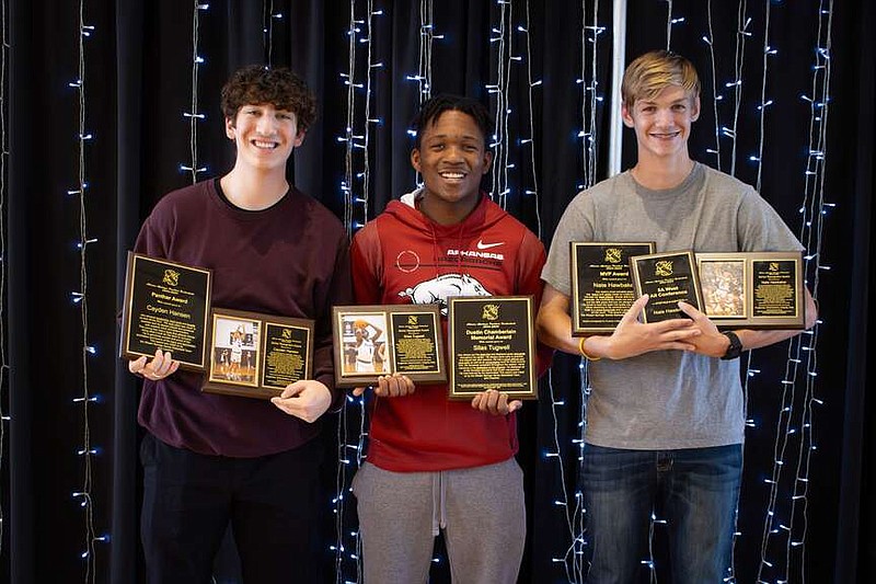 Photo courtesy of Krystal Elmore Siloam Springs Panthers Cayden Hansen, Silas Tugwell and Nathan Hawbaker display their awards at the Siloam Springs High School Basketball Banquet on March 10.